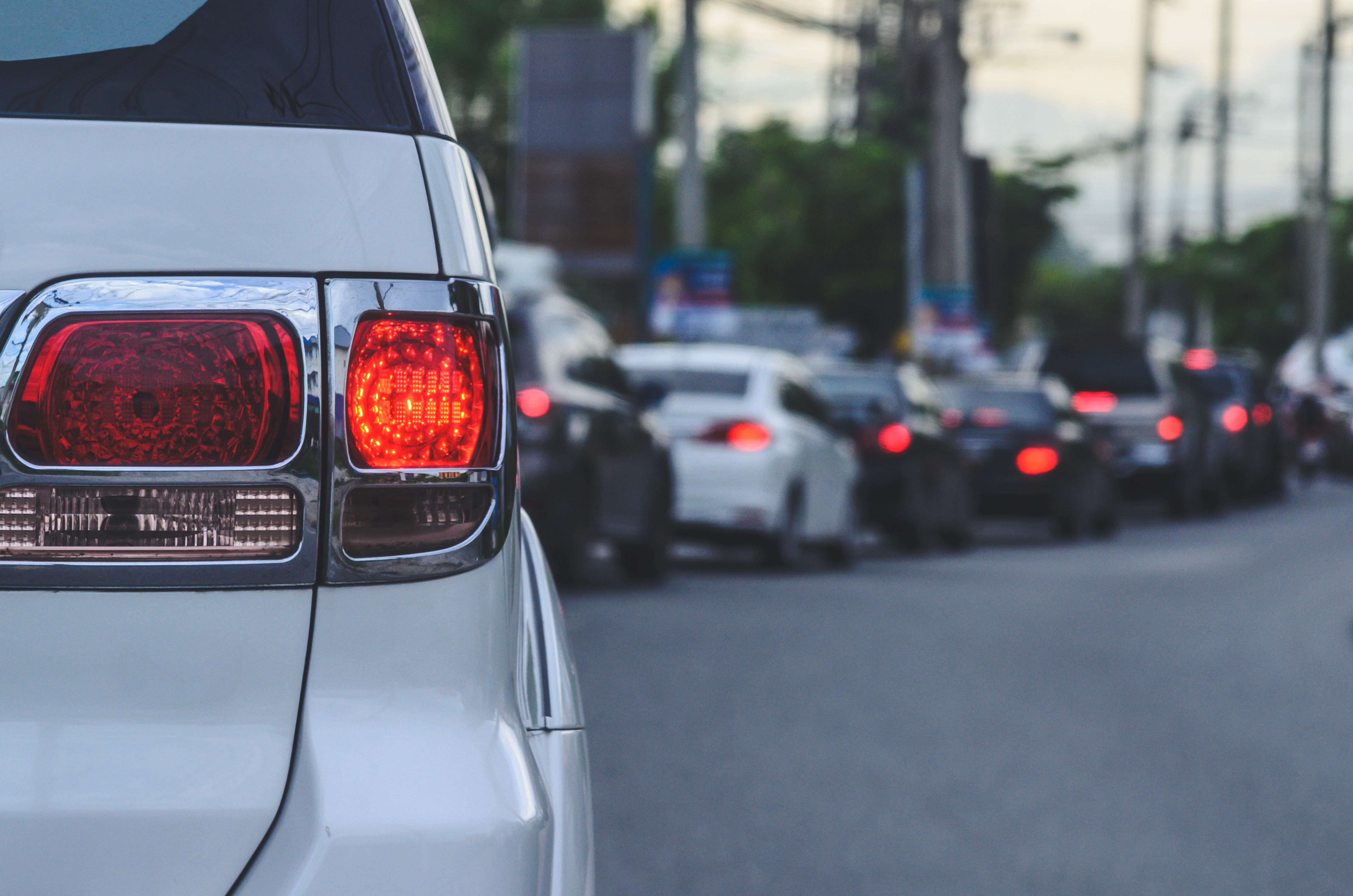 Car tail lights, traffic jams during rush hour.
